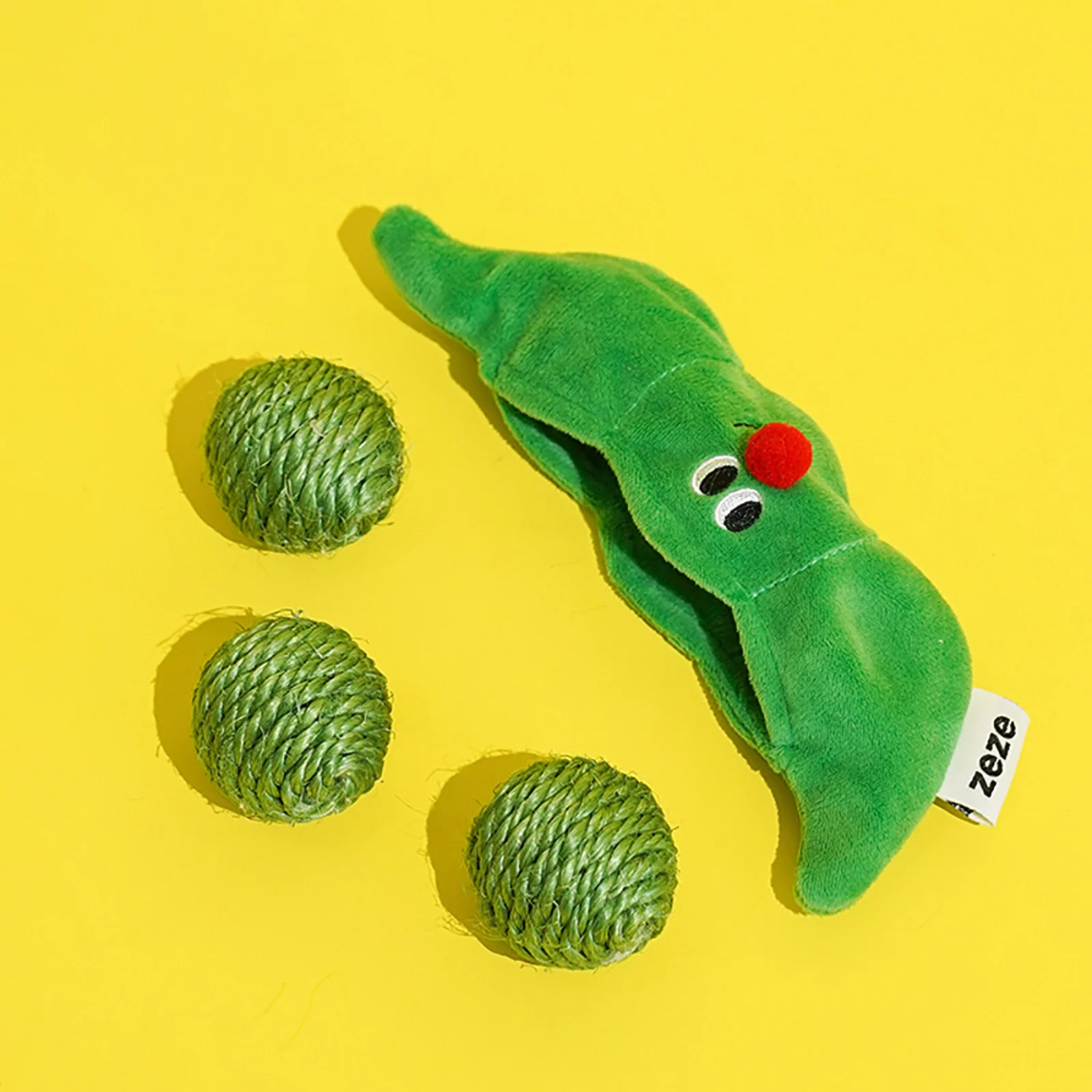 Three sisal cat toy balls with a plush pea pod